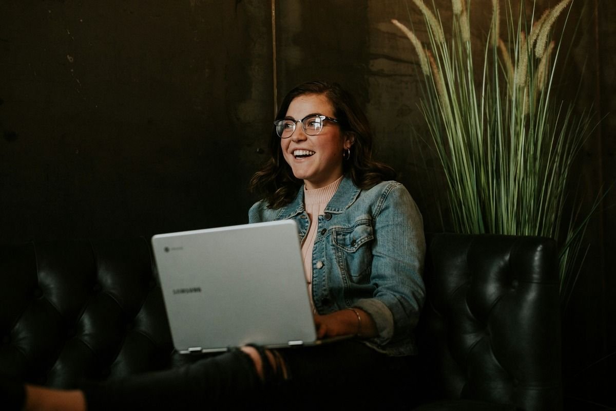 Woman on Laptop Performing an AI Candidate Review